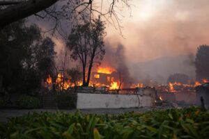 Palisades fire burning down a large home