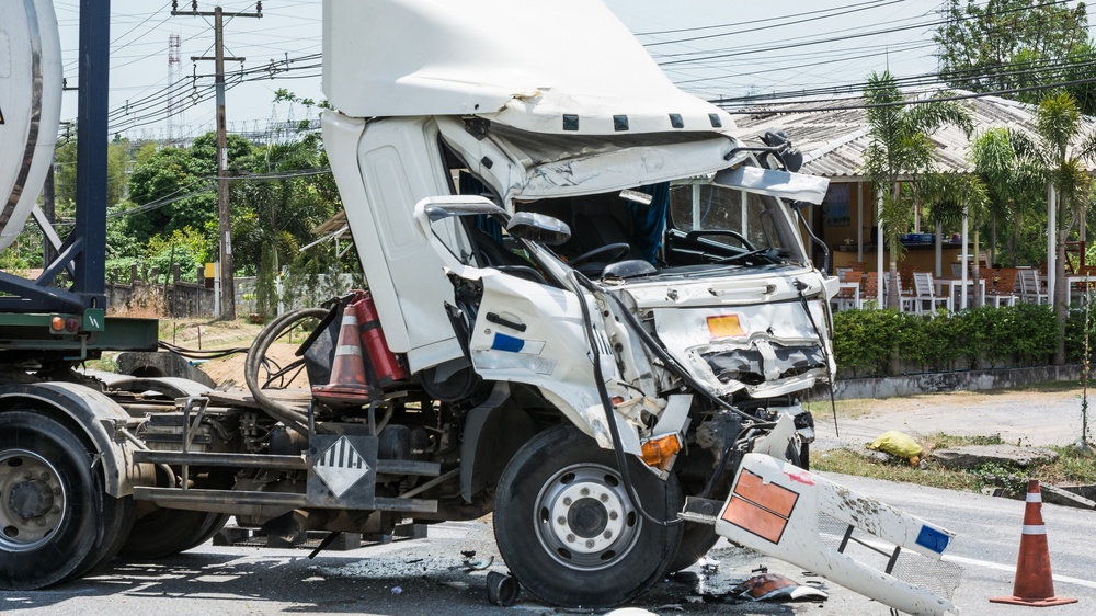 Damaged semi truck illustrating trucking company shared responsibility in Florida crash